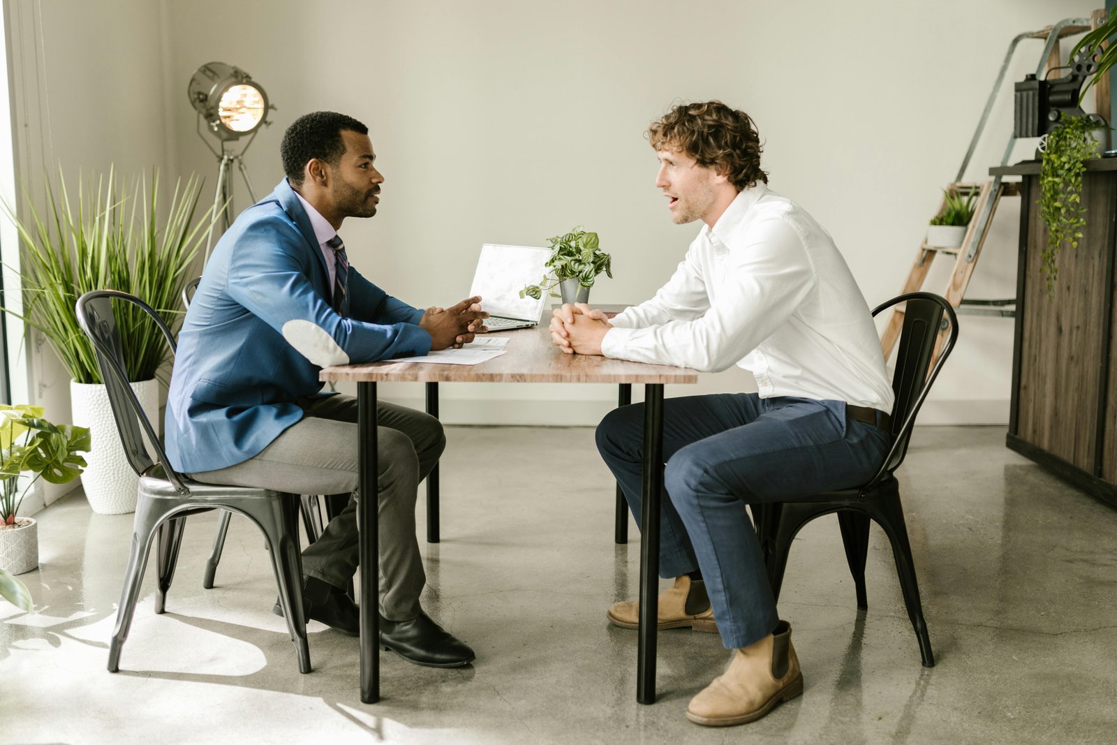 Two people talking at a table